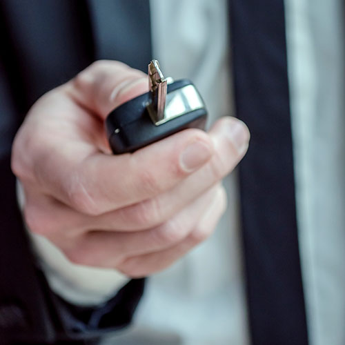 Man Holding Car Keys
